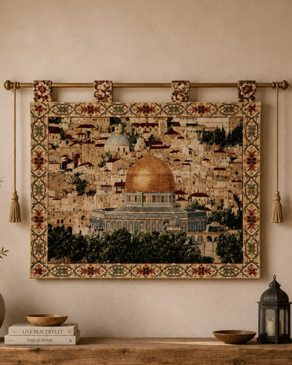 Large Al Aqsa Mosque decorative tapestry featuring the golden Dome of the Rock, elegantly displayed above a rustic wooden console table with books, lantern decor, and natural accents in a cozy Mediterranean-inspired interior.