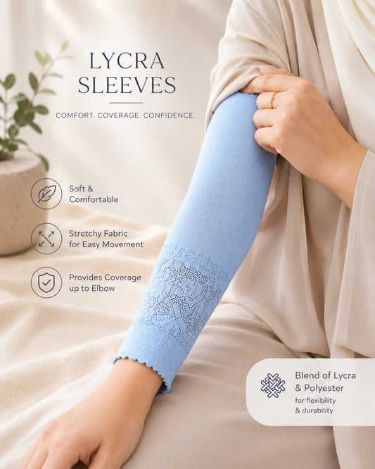 Light blue Lycra arm sleeve with delicate lace detailing displayed on a neutral beige background with soft fabric accents and greenery.