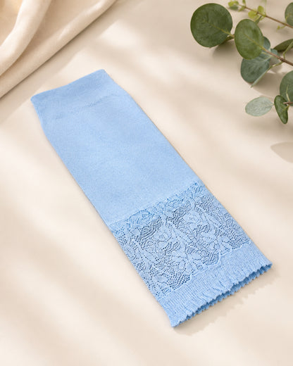 Light blue elbow-length Lycra sleeve with lace trim, designed for modest coverage and comfort, displayed in a neutral lifestyle flat-lay setting.