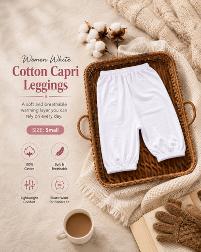 White cotton capri leggings for women folded in a woven basket with cozy winter accessories, featuring breathable cotton fabric and modest layering comfort.