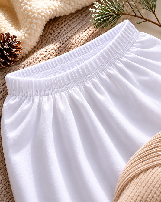Elastic waistband detail of women's white cotton capri leggings showing soft cotton material, stretch comfort, and secure fit for layering under dresses and skirts.