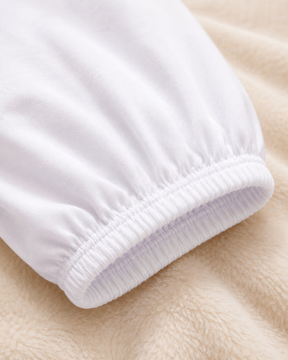 Elastic cuff detail of women's white cotton capri leggings showing breathable cotton fabric, stretch comfort, and secure modest fit under dresses and skirts.