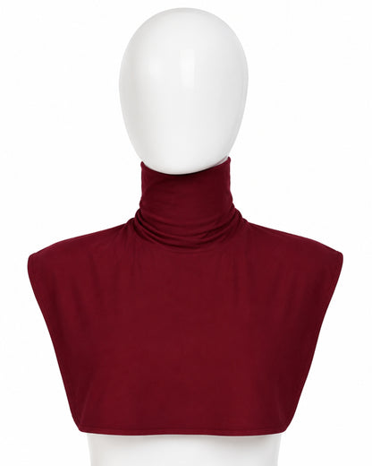 Red turtleneck top on a mannequin with a white background

