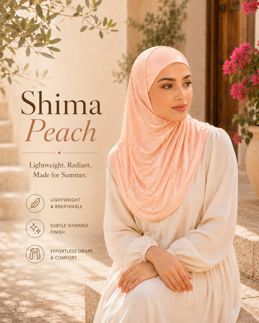 Woman wearing a peach hijab with product details on a blurred outdoor background